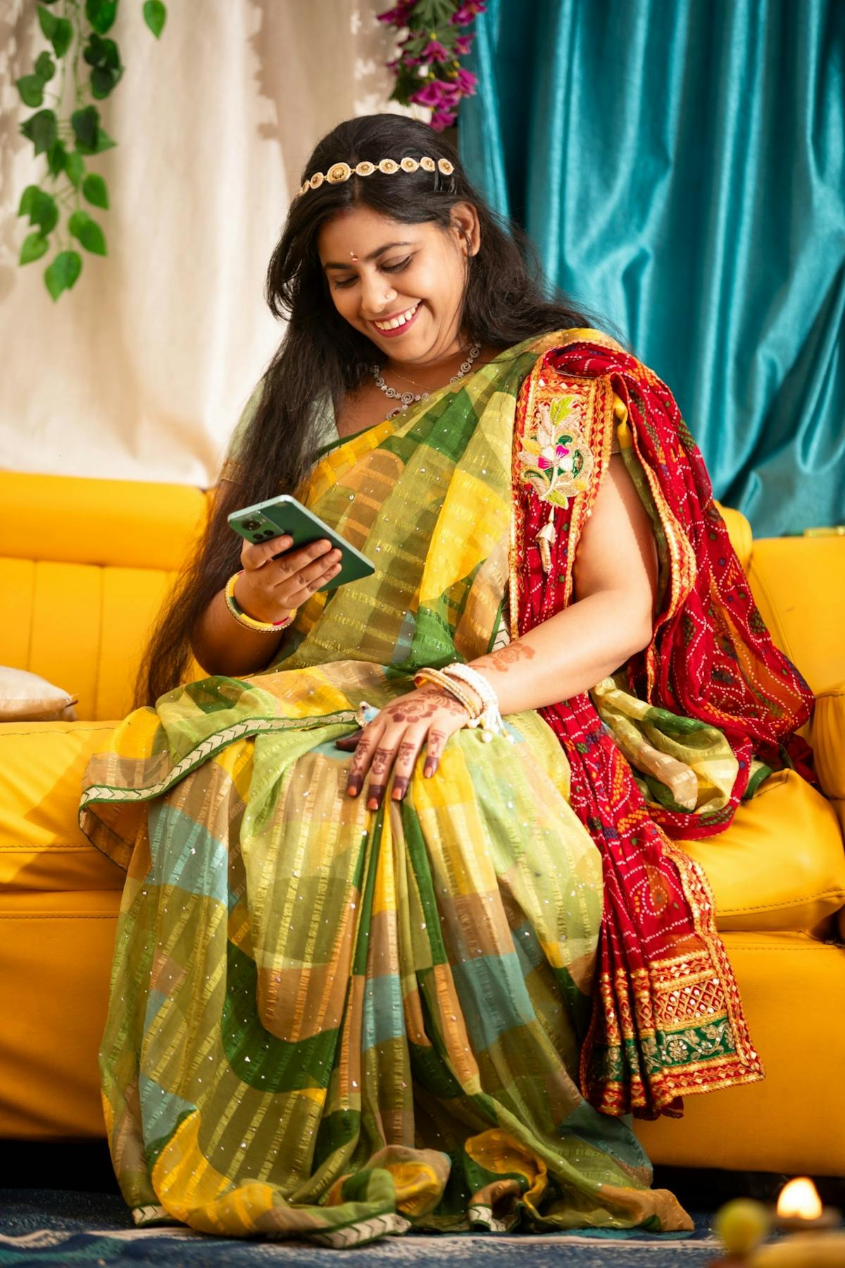 Indian woman in a sari reading a WhatsApp message from her dental clinic